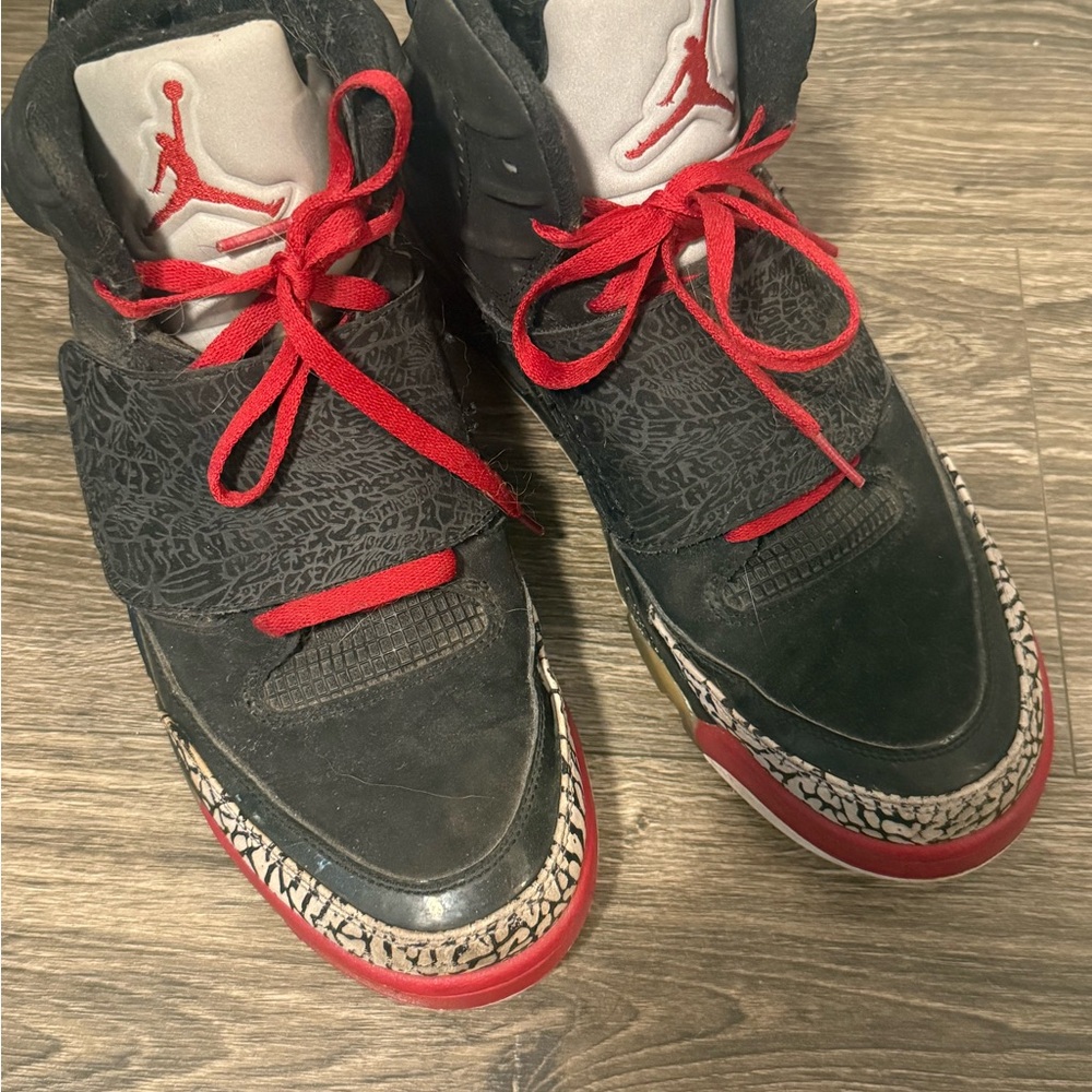 Jordan Black and Red Sneakers with Iconic Pattern